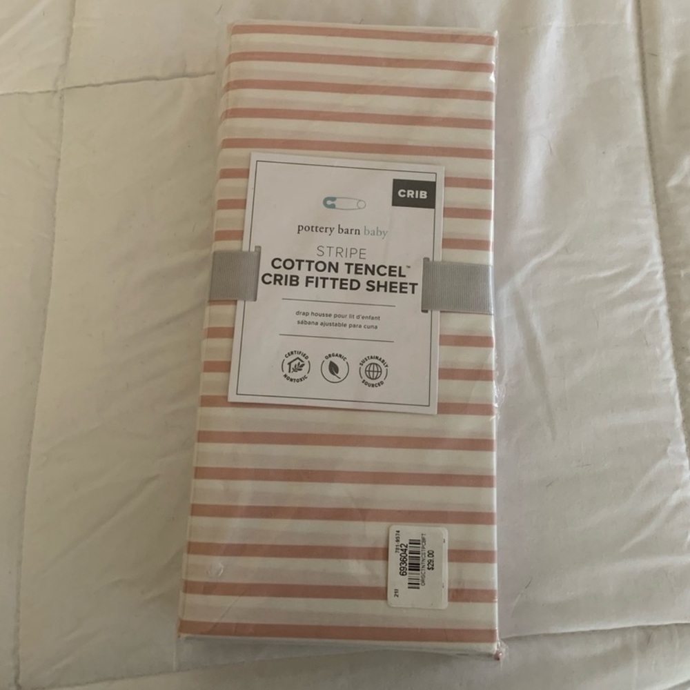 Pottery Barn baby pink “Stripe” fitted sheet